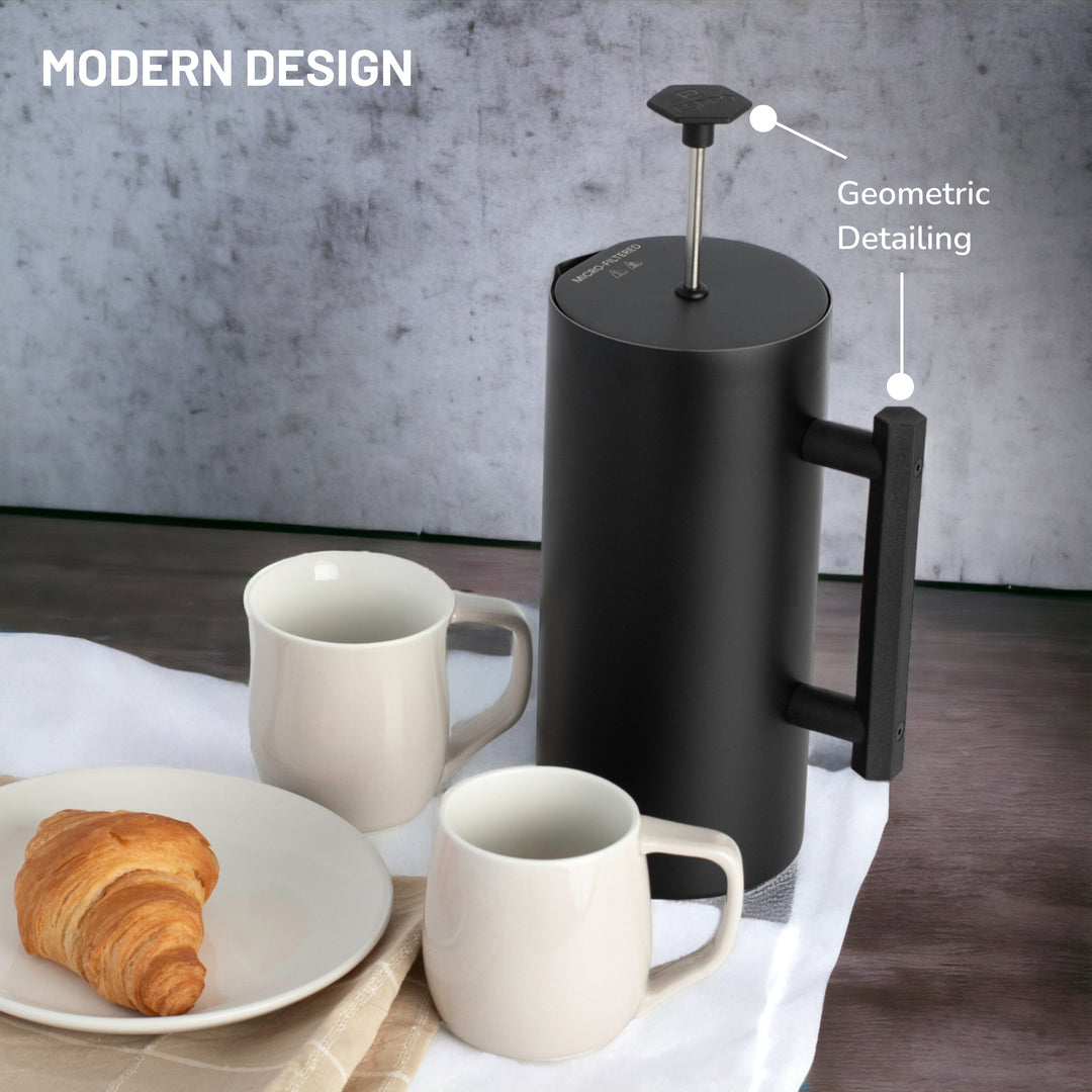 ESPRO P6 French Press on breakfast table next to croissants and mugs.