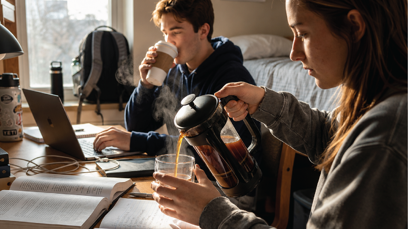 Students making coffee with the ESPRO P3 at a dorm desk